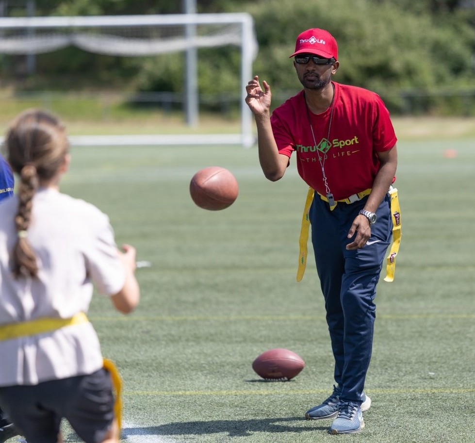 Thru Life staff coach participants in NFL Flag football